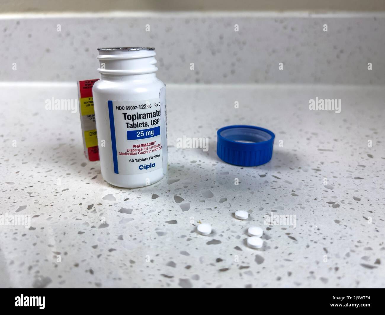 Seattle, WA USA - circa May 2022: Close up view of an angled bottle of Topiramate medication Stock Photo
