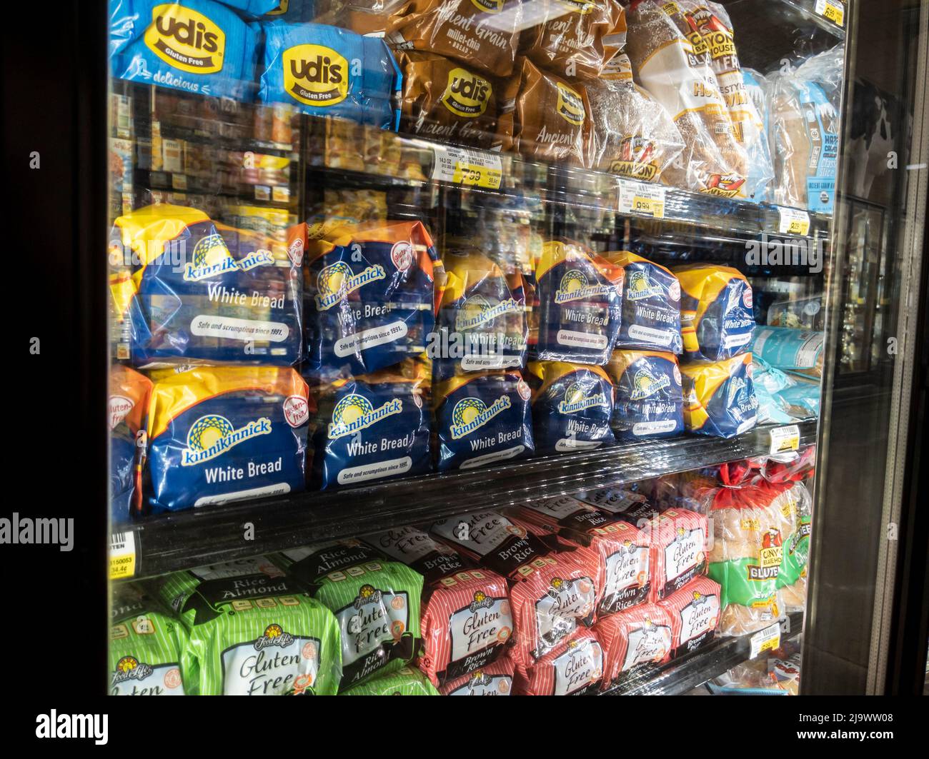 Woodinville, WA USA - circa April 2022: Angled view of Udi's brand gluten free bread for sale inside a freezer at Haggen Northwest Fresh grocery store Stock Photo