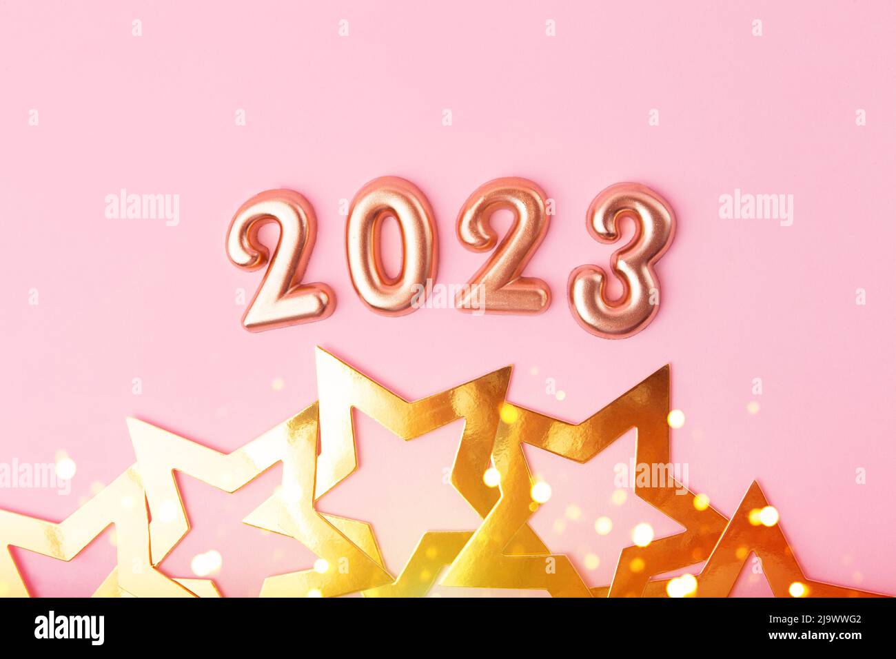 Top view of rose gold numbers 2024 on pink background.Festive ...