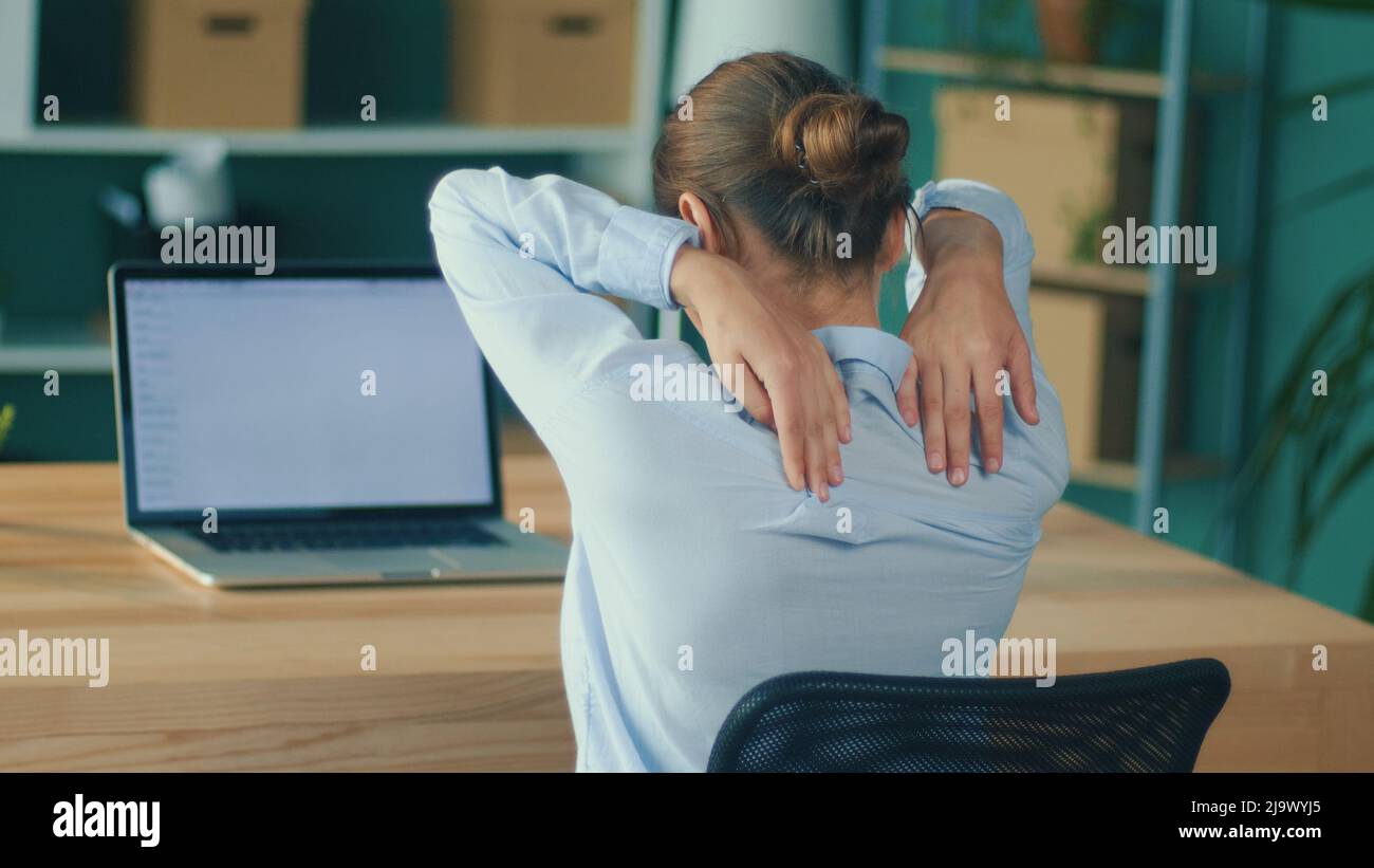 Back View of Woman Tired of Long Sedentary Lifestyle, Rubbing Massaging ...