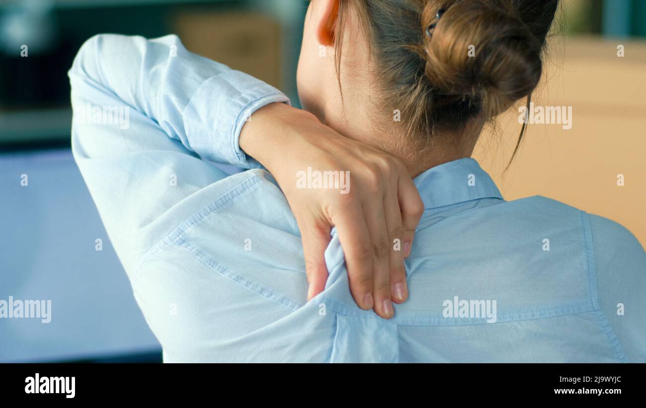 Back View of Woman Tired of Long Sedentary Lifestyle, Rubbing Massaging ...