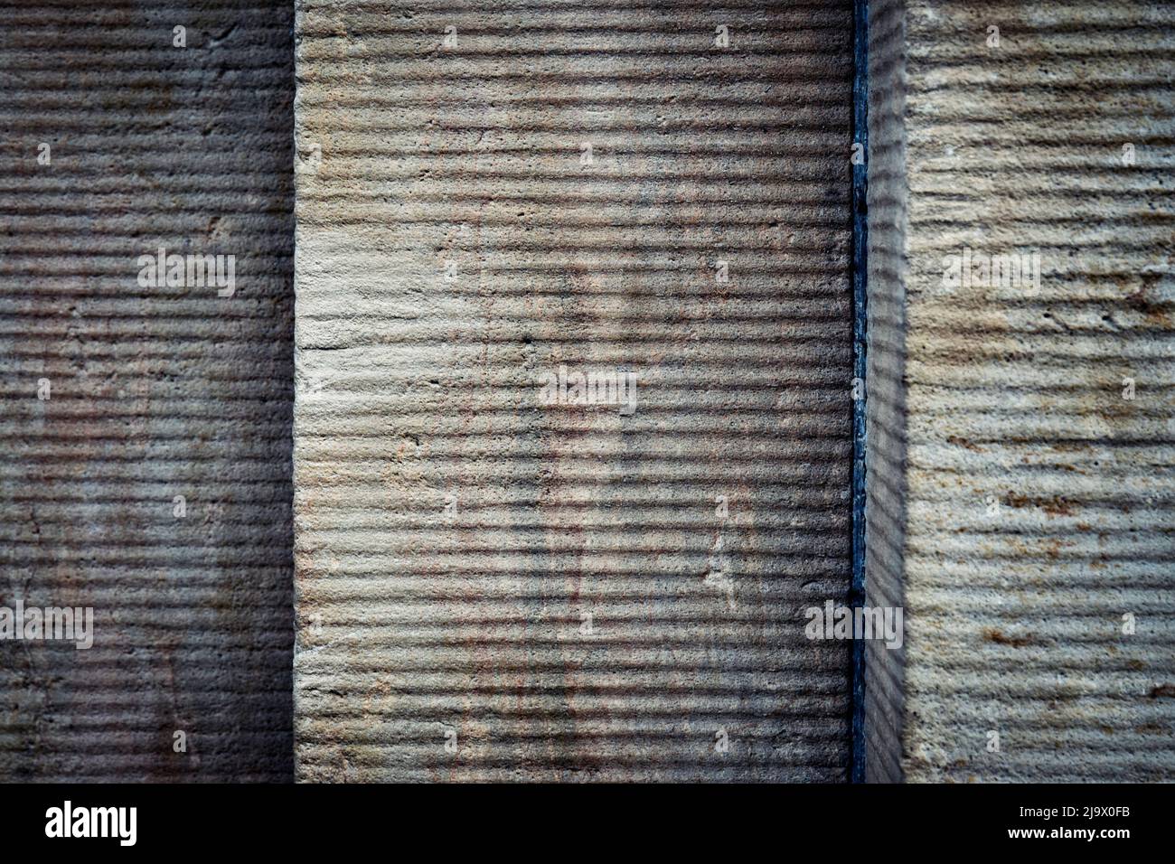 abstract background or texture Horizontally grooved concrete wall Stock