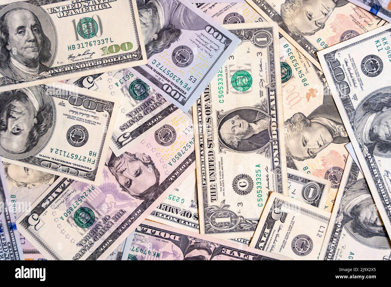 there are dollar bills on the table . background of banknotes. Stock Photo