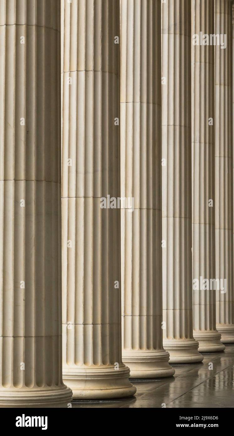 Many old greek columns with reflection Stock Photo - Alamy