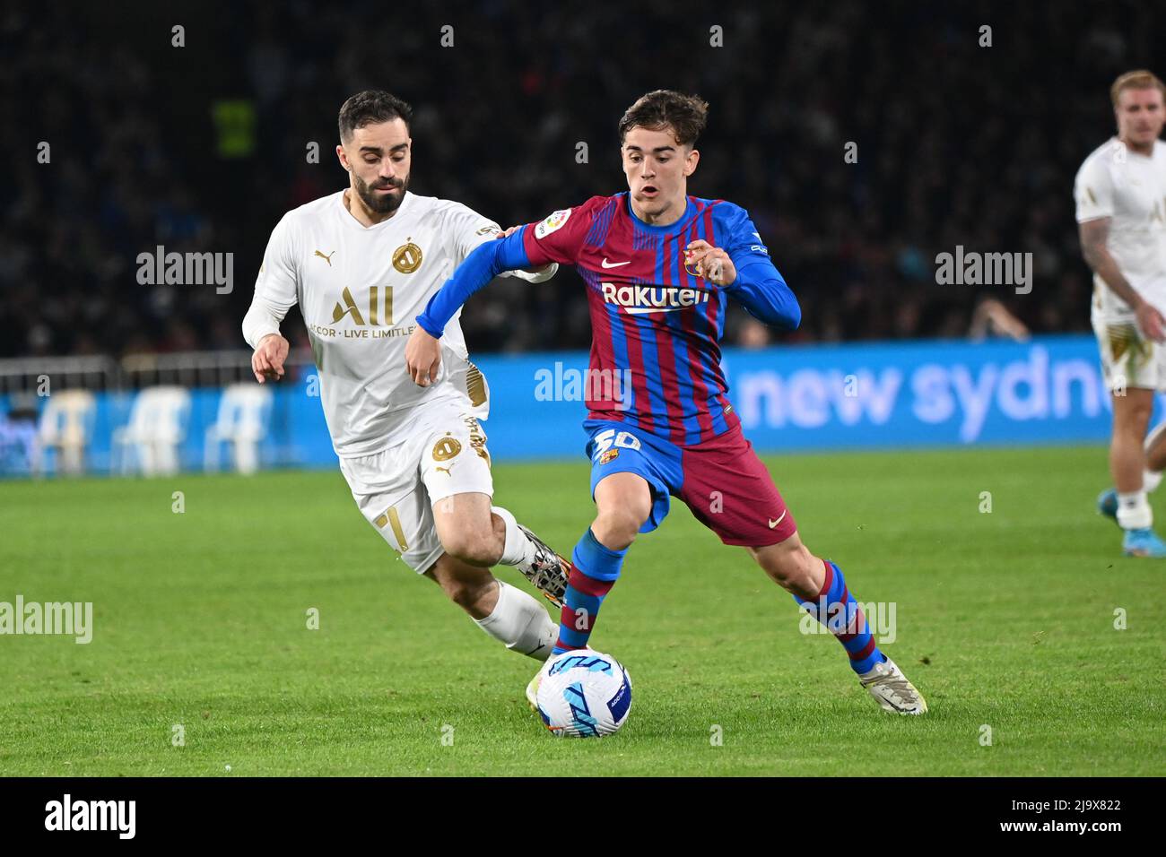 Sydney Olympic Park, Australia. 25th May, 2022. Anthony Caceres (L) of A-Leagues All Stars team and Pablo Martín Páez Gavira (R) in action during the match between FC Barcelona and the A-League All Stars at Accor Stadium. (Final score; FC Barcelona 3:2 A-Leagues All Stars). Credit: SOPA Images Limited/Alamy Live News Stock Photo