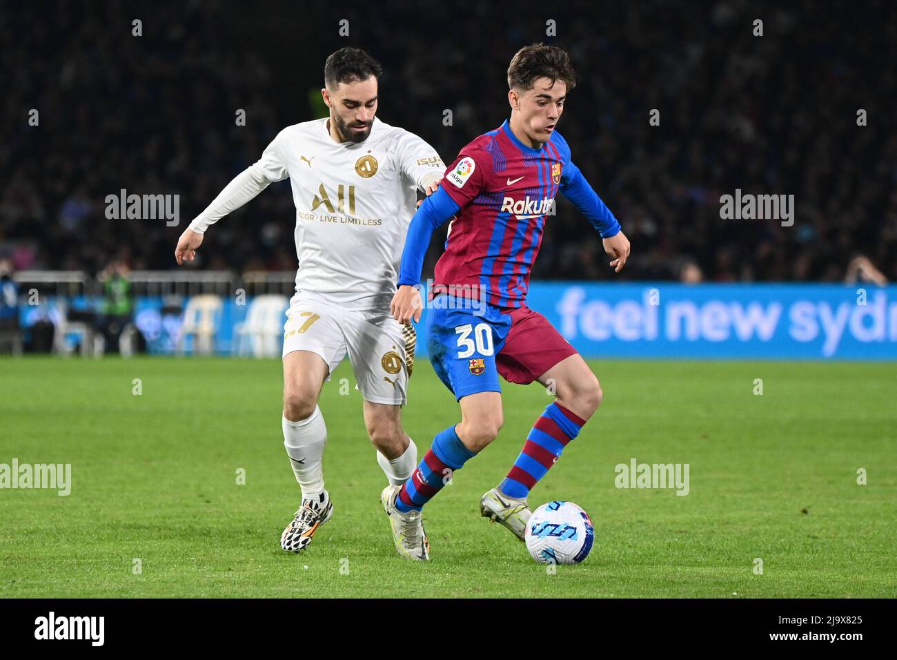 Sydney Olympic Park, Australia. 25th May, 2022. Anthony Caceres (L) of A-Leagues All Stars team and Pablo Martín Páez Gavira (R) in action during the match between FC Barcelona and the A-League All Stars at Accor Stadium. (Final score; FC Barcelona 3:2 A-Leagues All Stars). Credit: SOPA Images Limited/Alamy Live News Stock Photo