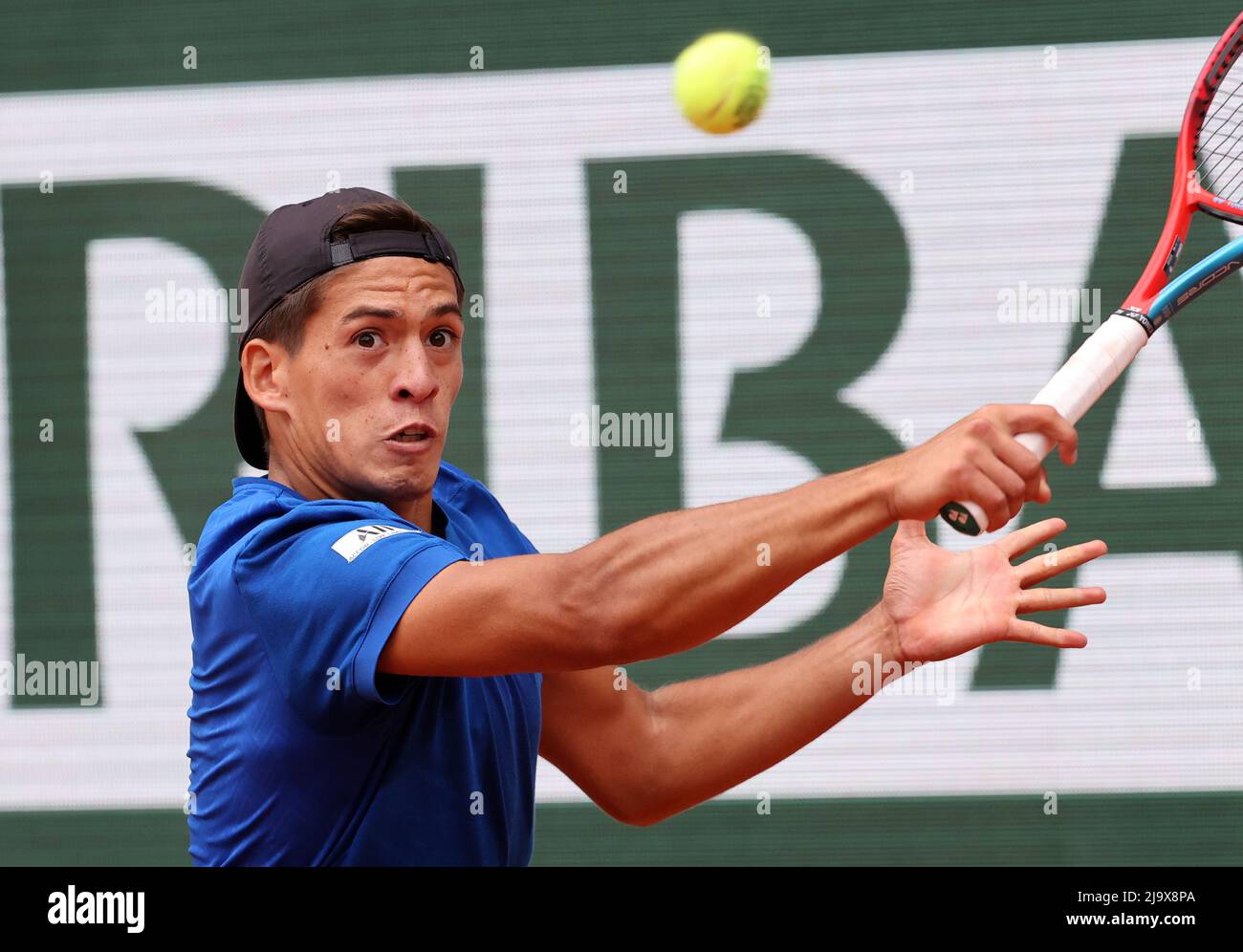 Paris, France. 25th May, 2022. Sebastian Baez of Argentine plays against  German Alexander Zverev during their French Tennis Open match at Roland  Garros near Paris, France, on Wednesday 25 May, 2022. Zverev