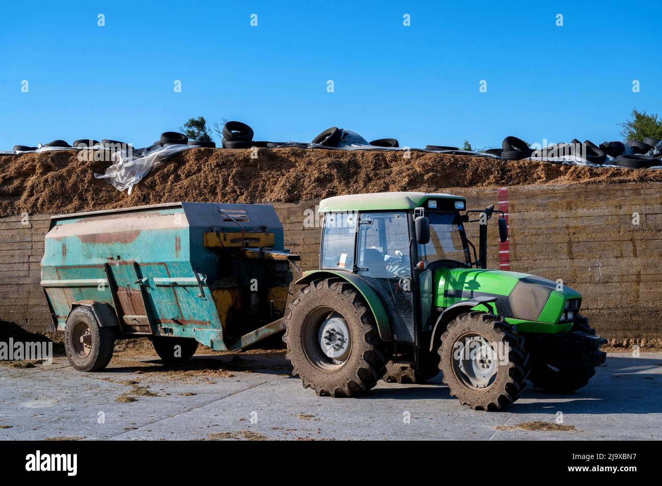 Feed greender for animals attached to tractor. Forage shredder Stock