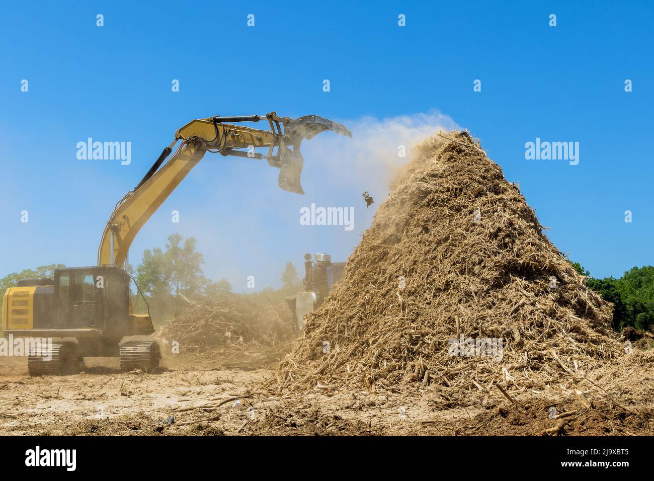 Construction site area in wood chipper machine with mulch an work Stock