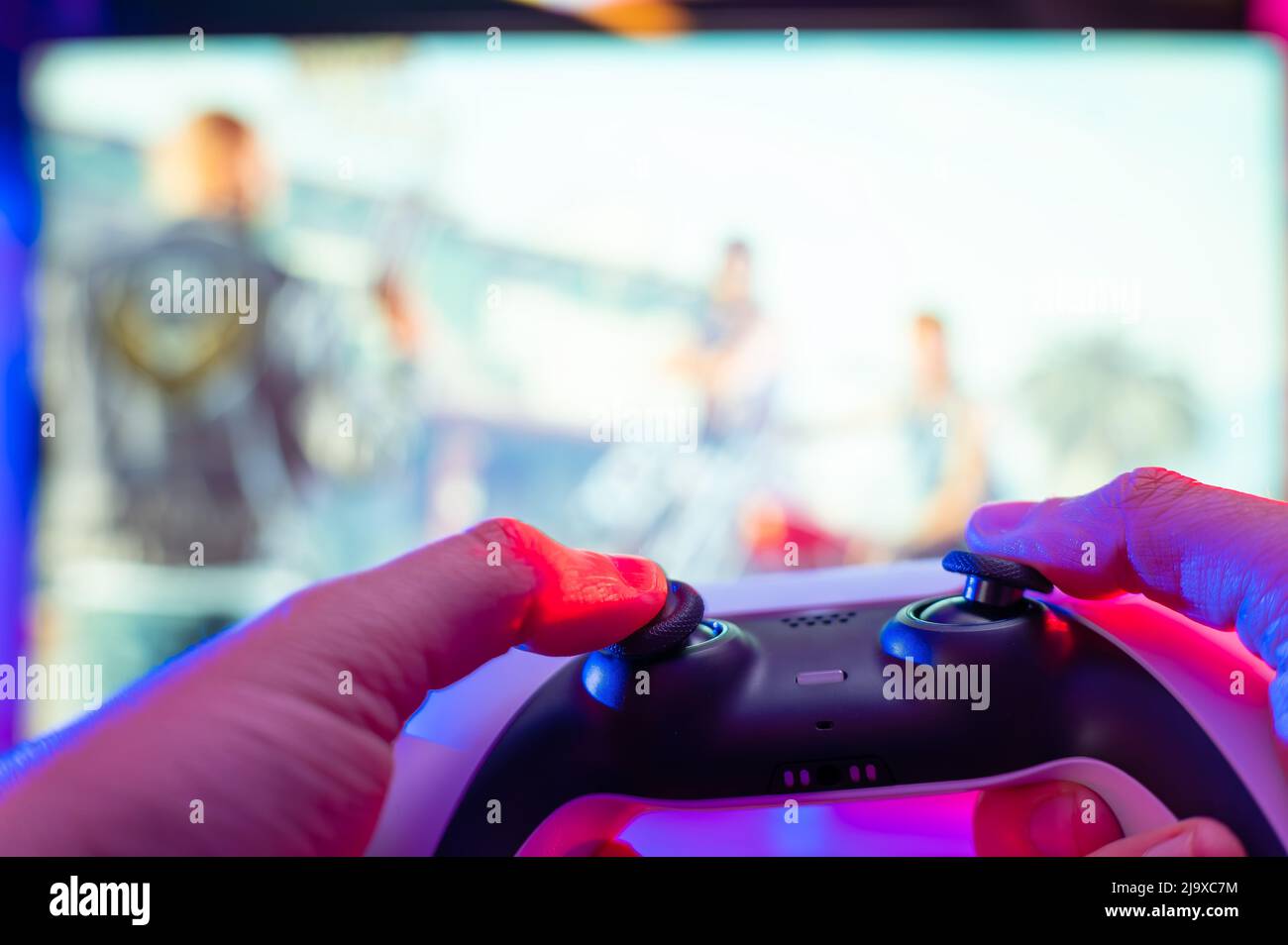 Gamepad in the hand of a gamer. Close-up. Teenagers play video games online.  Fun adventure games. Prizes, gifts, win. Fun, passion, hobby. Cybersport  Stock Photo - Alamy
