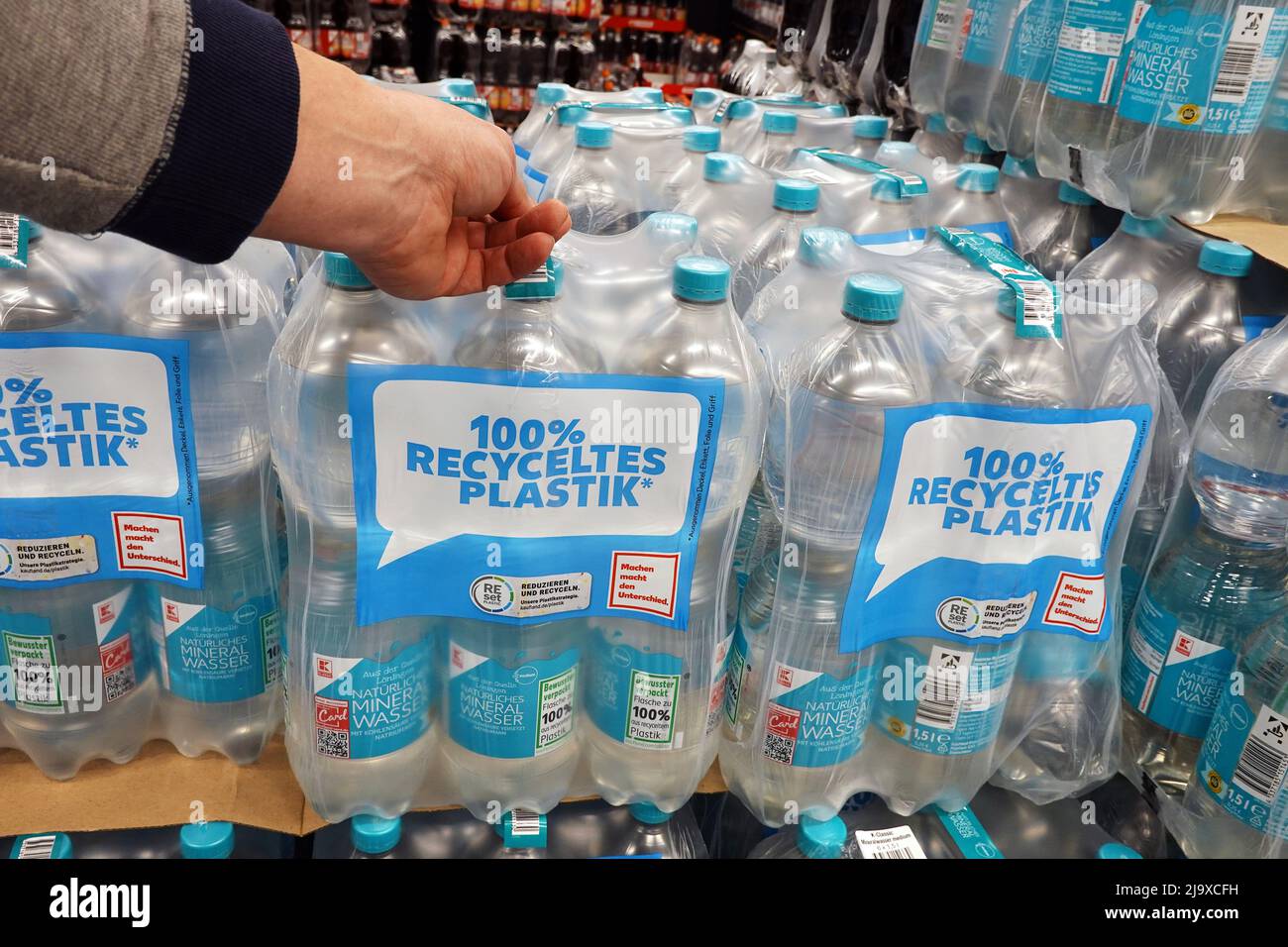 Buying Water in Recycled plastic bottles Stock Photo