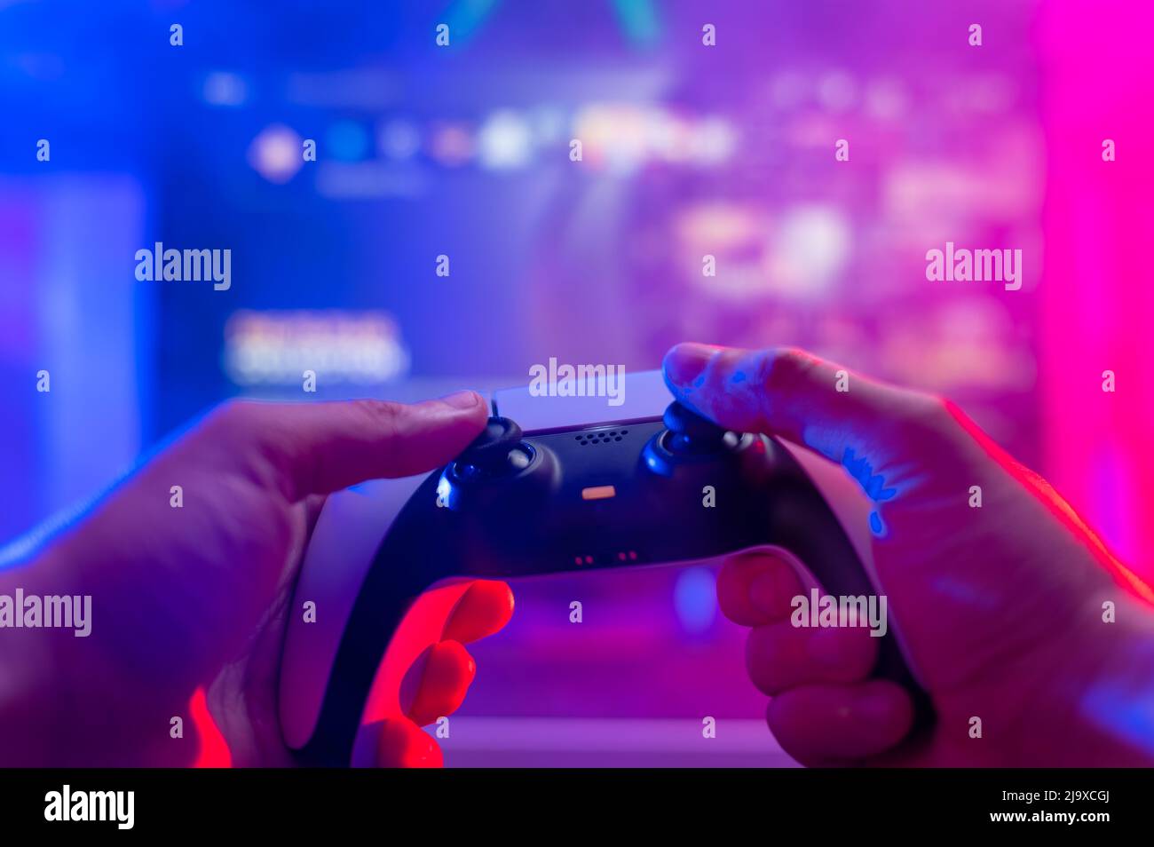 Closeup. Modern gamepad in the hands of a gamer on a technological