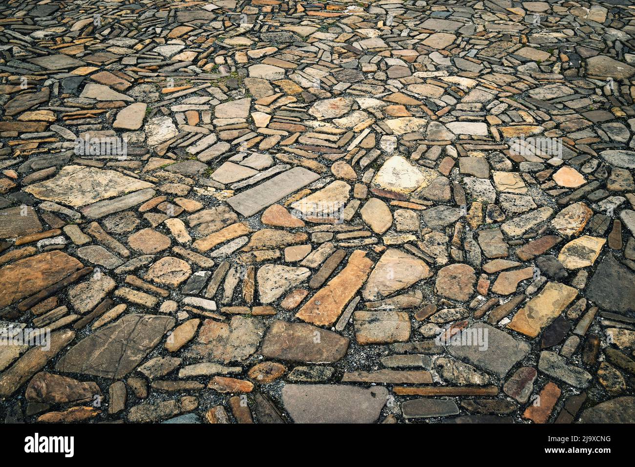 background or texture medieval stone pavement on the street Stock Photo