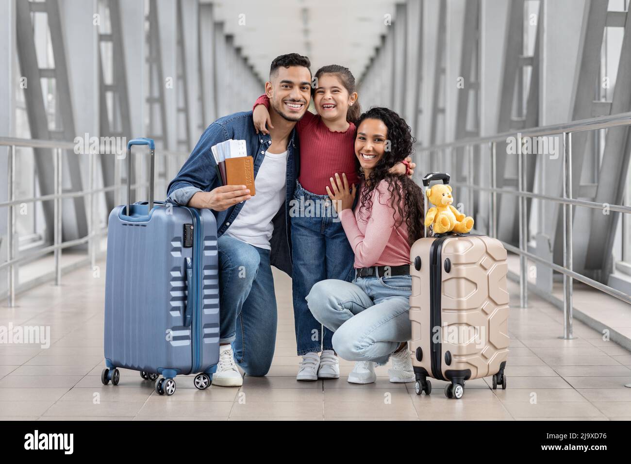 Happy Arab Family With Passports And Luggage Relaxing At Airport ...