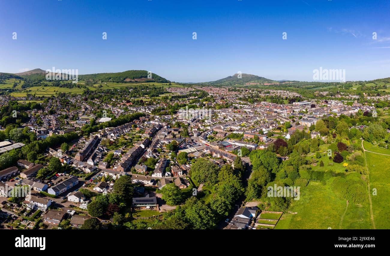 Aerial view of the Welsh town of Abergavenny surrounded by green fields and hills (Wales, UK) Stock Photo