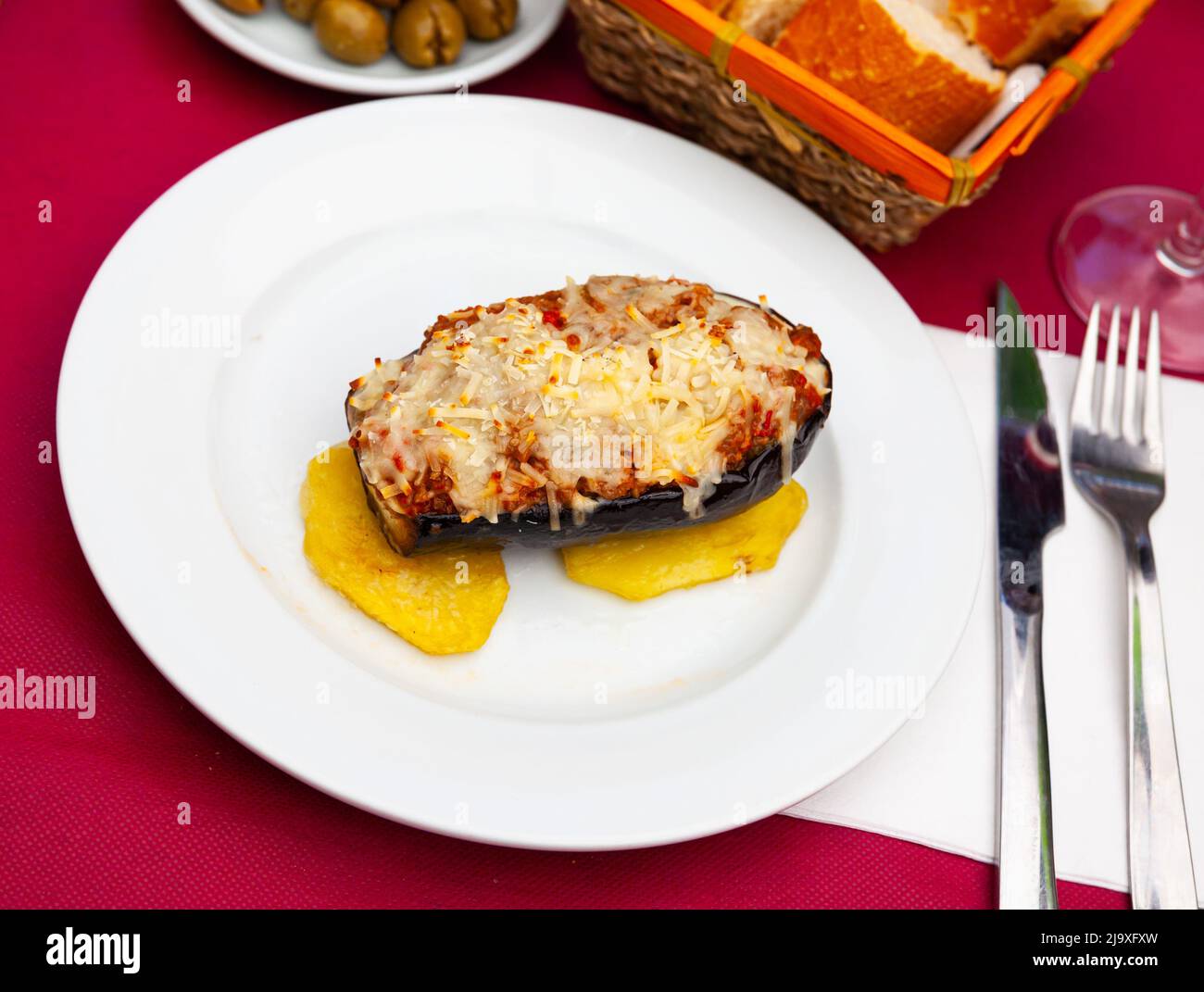 Grilled stuffed eggplant with slices of baked potato Stock Photo Alamy