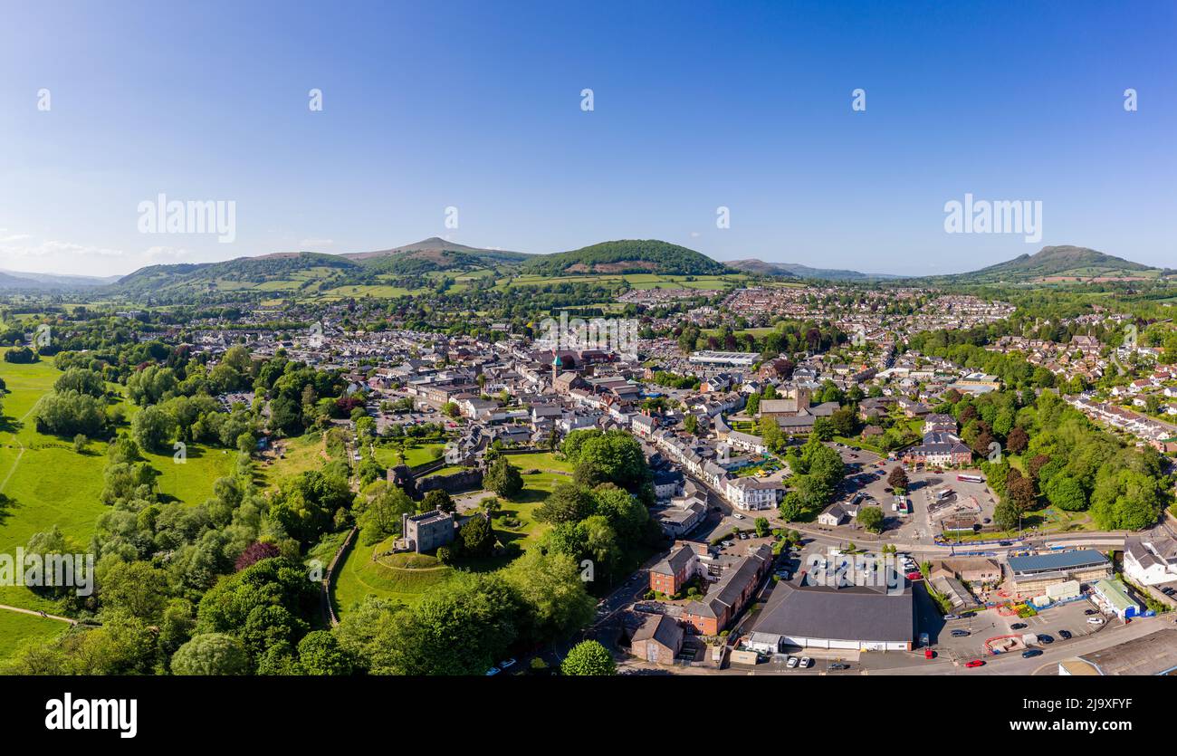 ABERGAVENNY, WALES - MAY 14 2022: Aerial view of the Welsh market town of Abergavenny, Monmouthshire surrounded by green fields and hills. Stock Photo