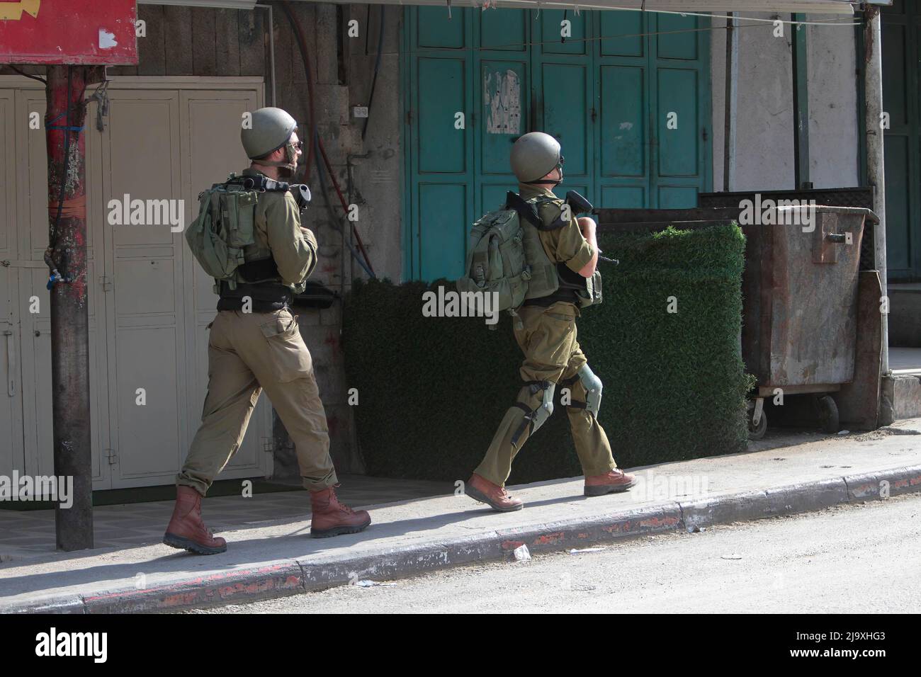 Nablus, Palestine. 12th May, 2022. Israeli soldiers patrolling while protecting Jewish settlers during a 'March For Flags' in the middle of the market in the town of Hawara, south of Nablus in the West Bank. Credit: SOPA Images Limited/Alamy Live News Stock Photo