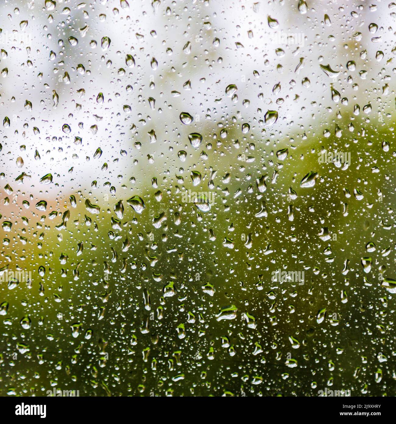 Drops of rain on glass background Stock Photo - Alamy