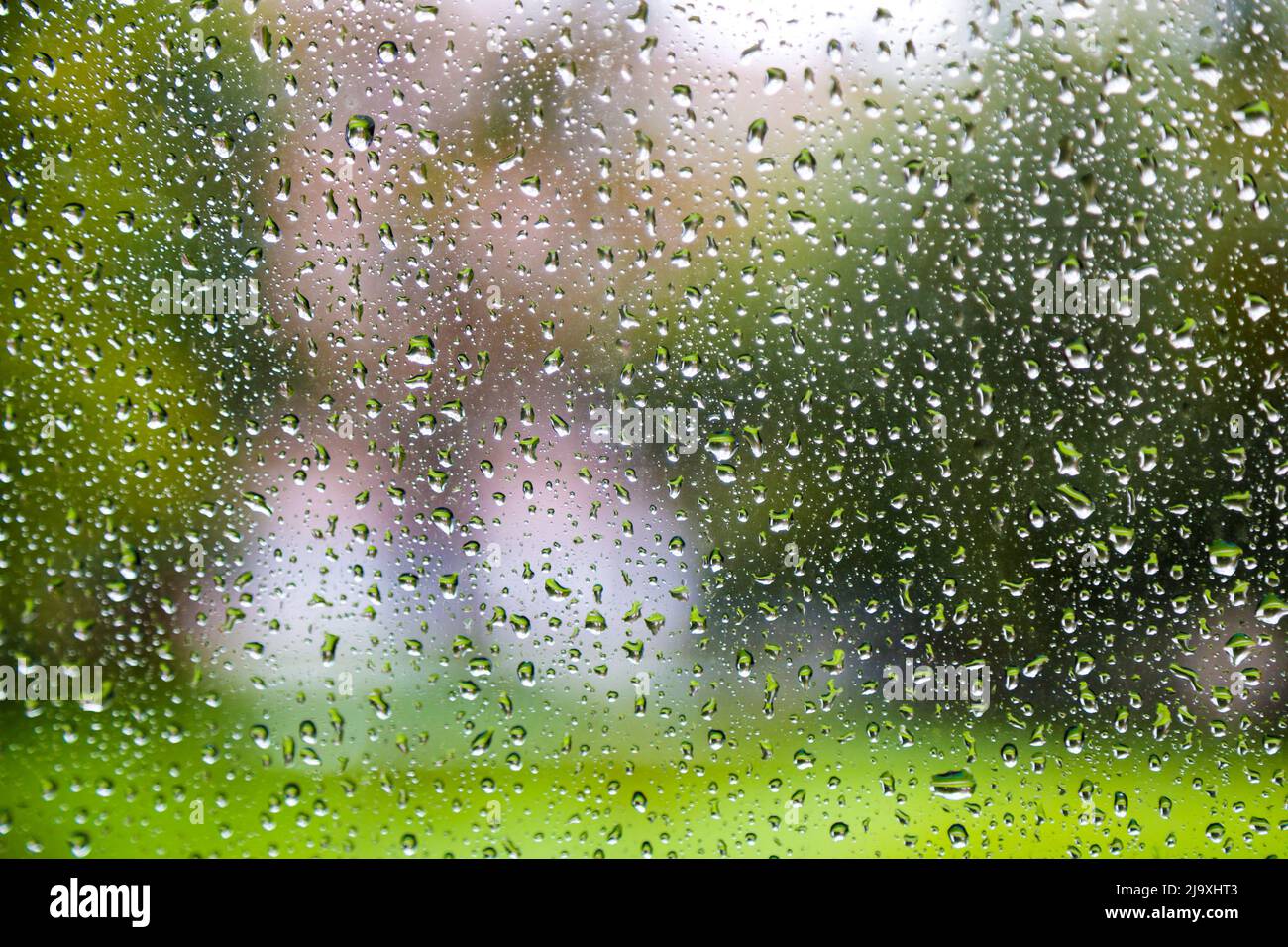 Drops of rain on glass background Stock Photo - Alamy