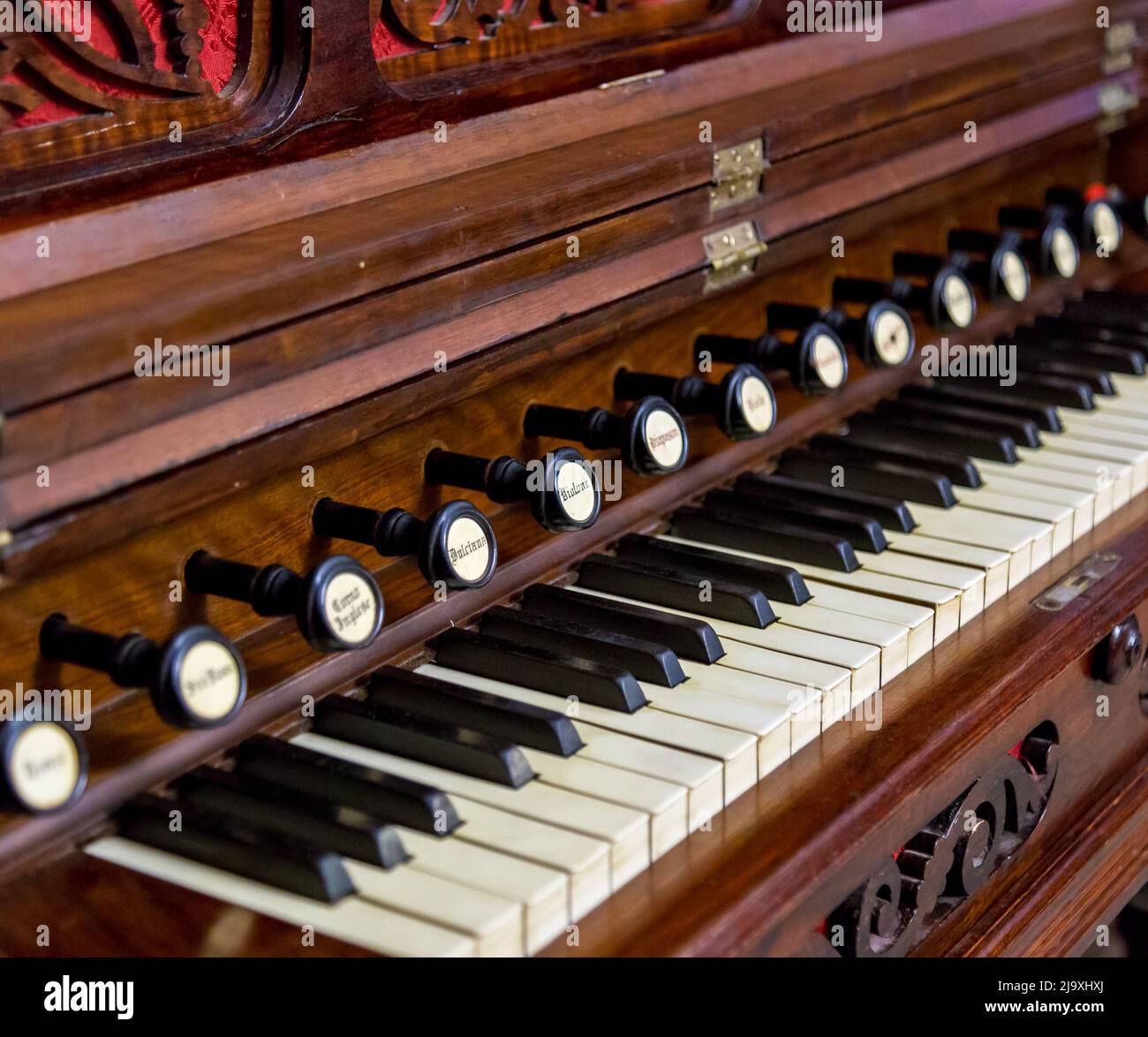 Close-up of antique reed organ harmonium. Stock Photo