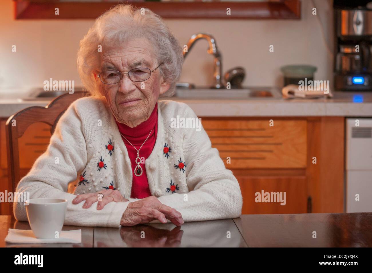 Elderly woman looking sad and depressed Stock Photo