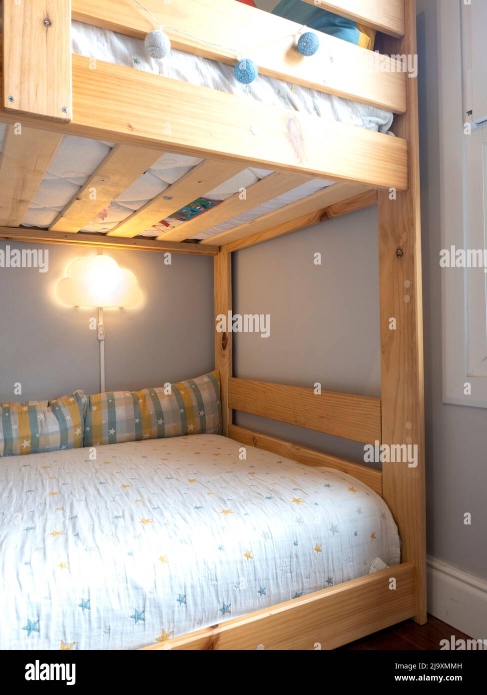 Montessori children's room with bunk bed and climbing wall Stock Photo