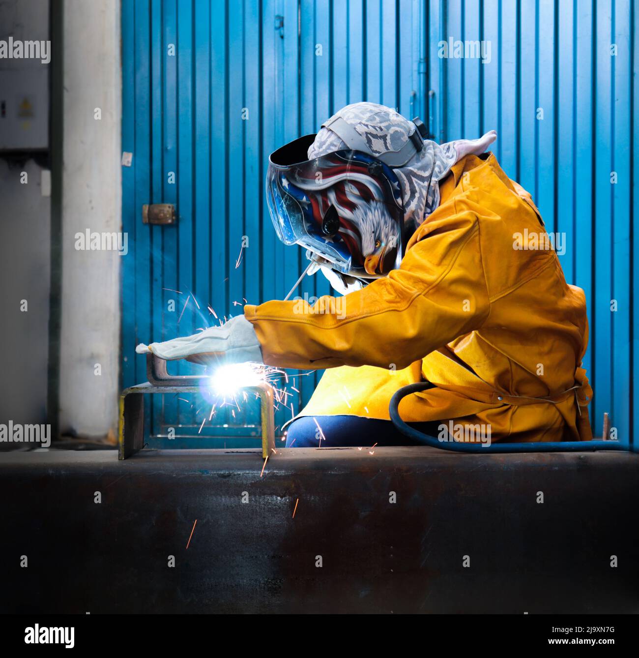 Industrial welder in mechanical workshop Stock Photo