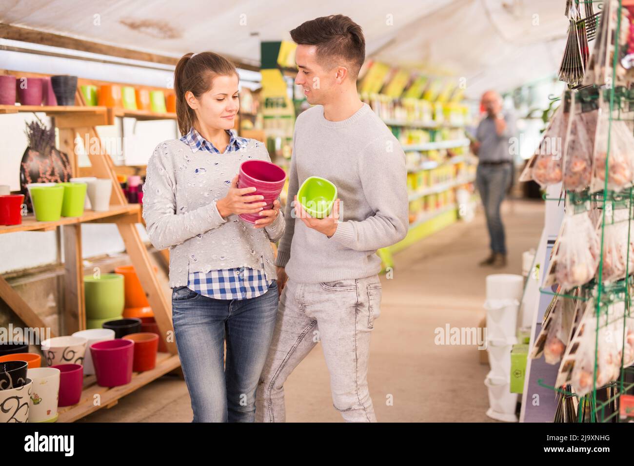 Portrait of positive young couple at the garden store Stock Photo