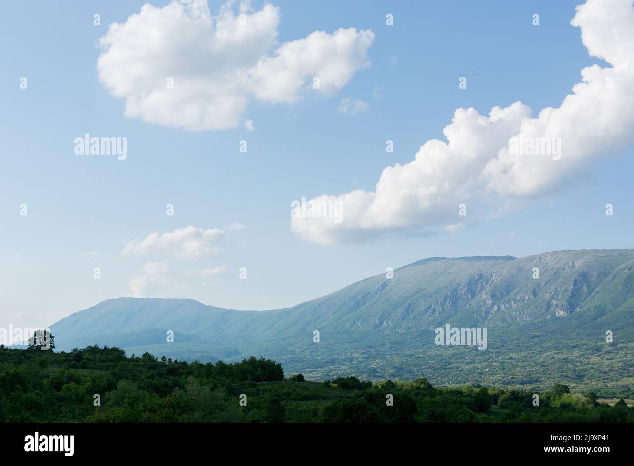 Beautiful panorama view of Suva Planina, a chain of mountains and hills in Serbia, with forests, hills and agricultural fields on a spring sunny day Stock Photo
