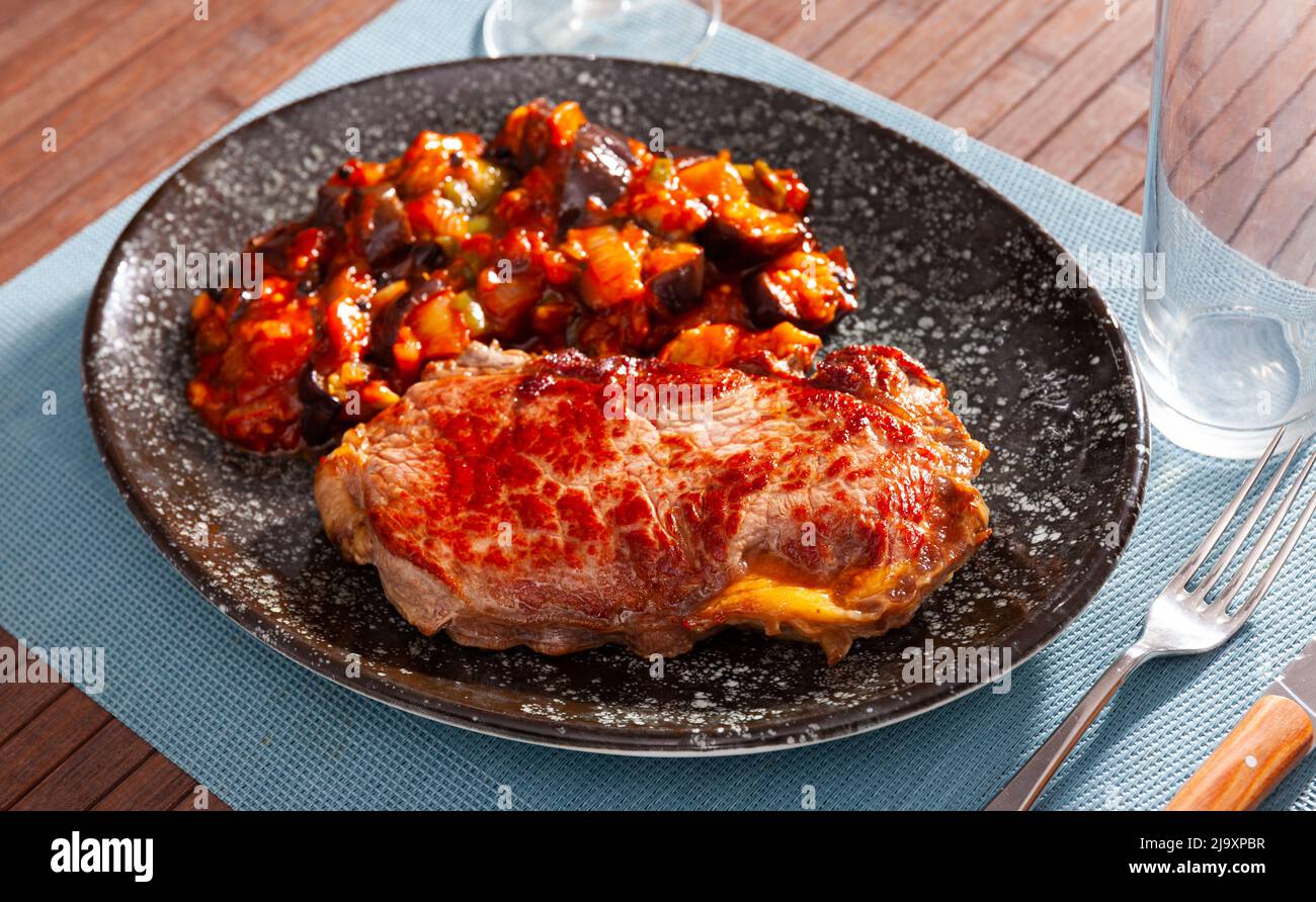 Beef steak with eggplant vegetable saute with bell pepper, onion and