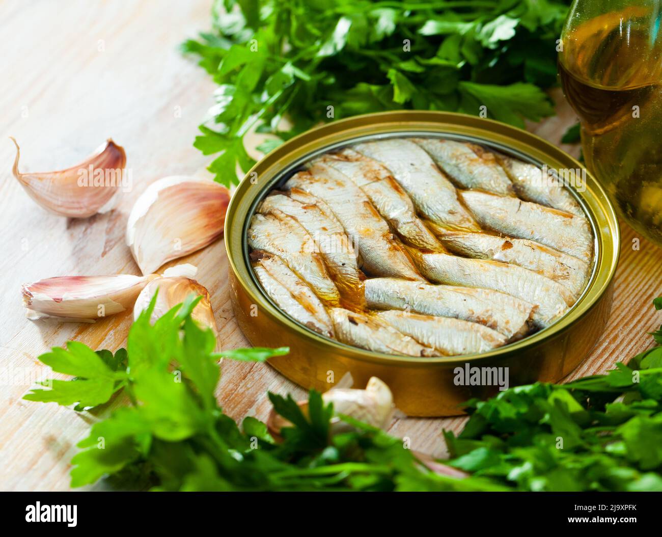 Open tin can with sardines in oil Stock Photo Alamy