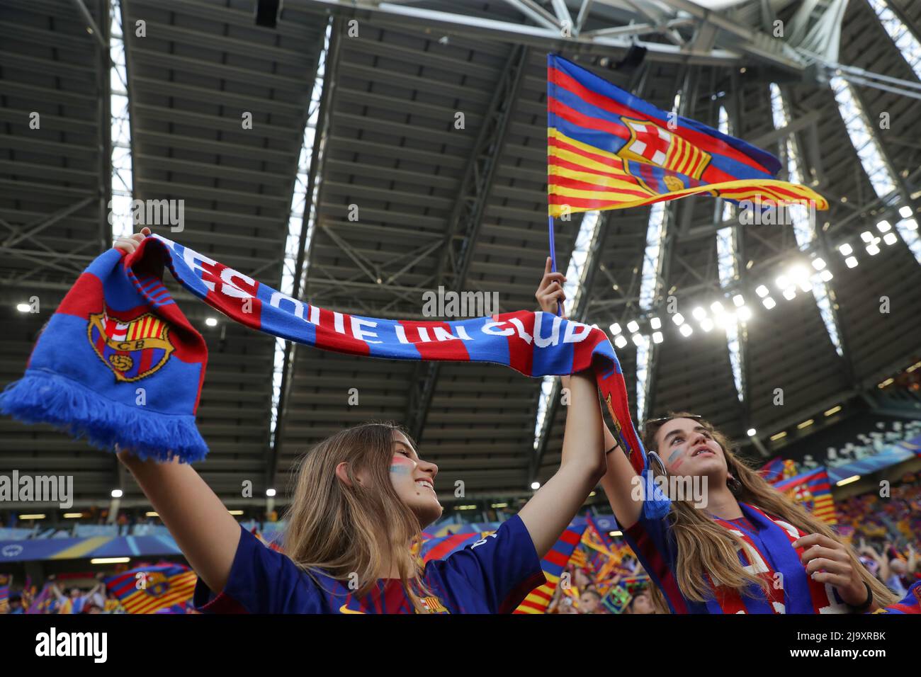 Turin, Italy, 21st May 2022. Female FC Barcelona fans hold a scarf and wave a flag prior to the UEFA Womens Champions League match at Juventus Stadium, Turin. Picture credit should read: Jonathan Moscrop / Sportimage Stock Photo