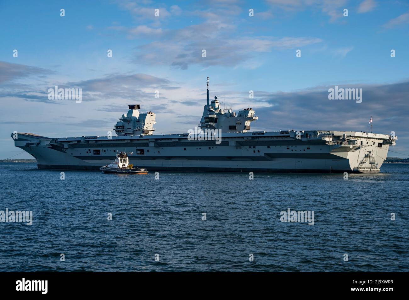 The Royal Navy aircraft carrier HMS Prince of Wales (R09) departed Portsmouth, UK on the evening of 23/5/2022 to resume NATO command ship duties. Stock Photo