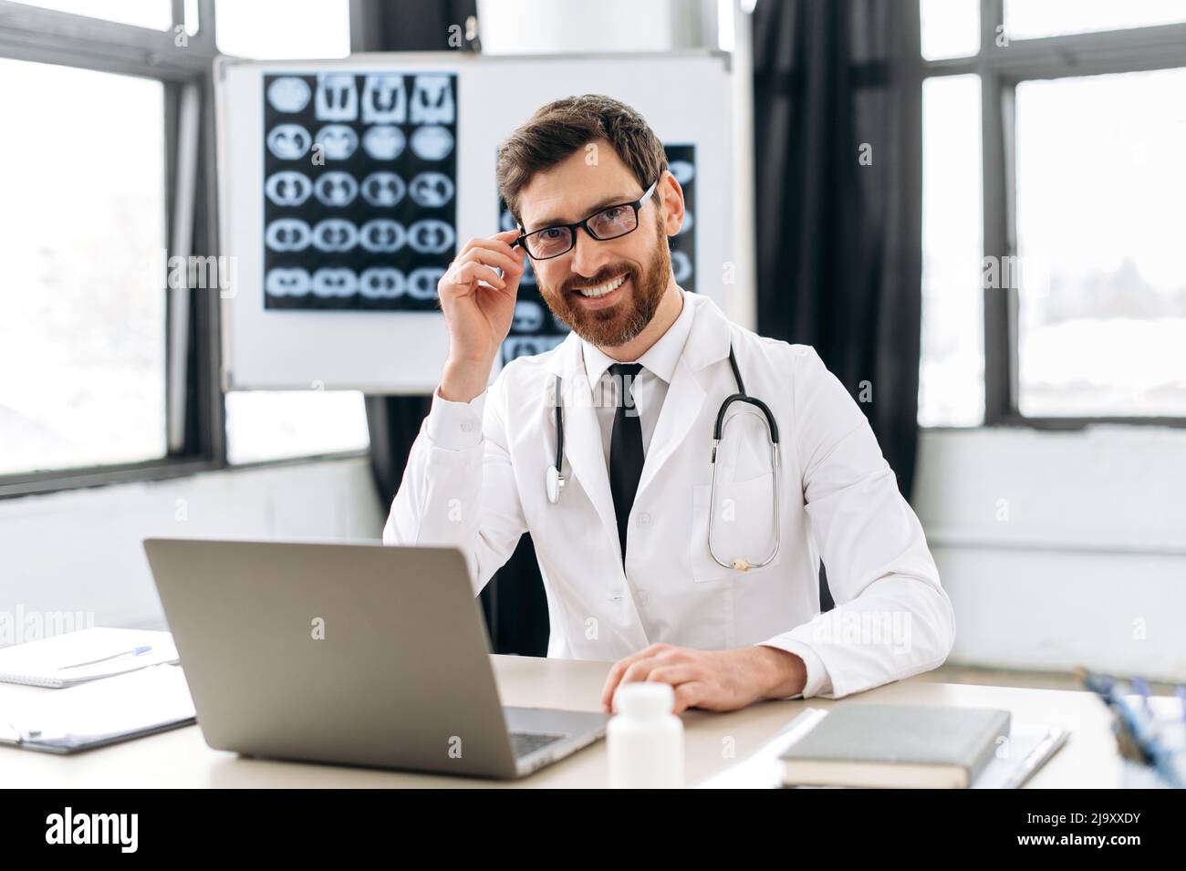 Portrait of a positive confident caucasian male professional doctor ...
