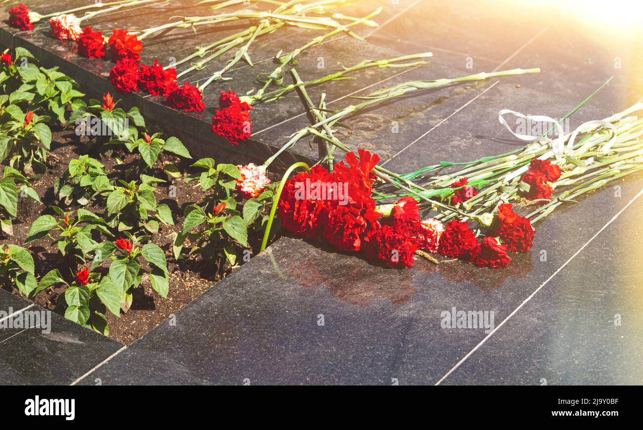 Commemorative memorial. Laying flowers at the eternal fire. Tribute to