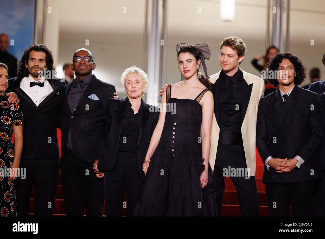 Olivier Delbosc, Nick Romano, Claire Denis, Margaret Qualley, Joe Alwyn,  Danny Ramirez and Stuart A. Staples attending the screening of "Stars At  Noon" during the 75th annual Cannes film festival at Palais