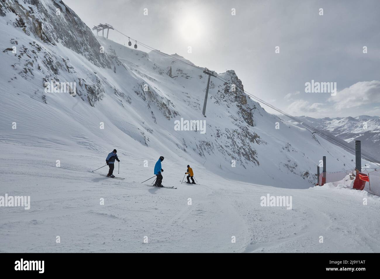 Skiing slopes with skiers Stock Photo
