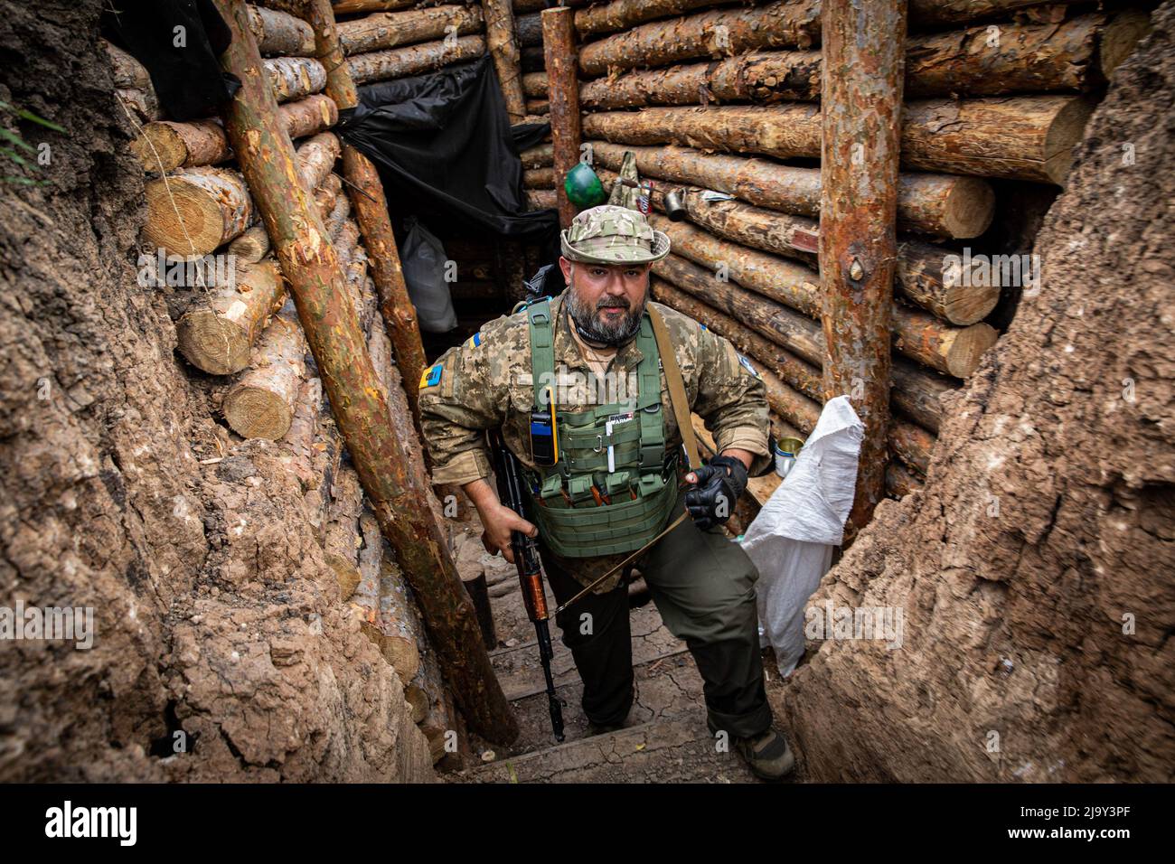 Soldier Maxim Varan walks in the trenches at an undisclosed defence  position on the outskirt of the separatist region of Donetsk (Donbas).  Ukraine's Donetsk (Donbas) region is under heavy attack from the