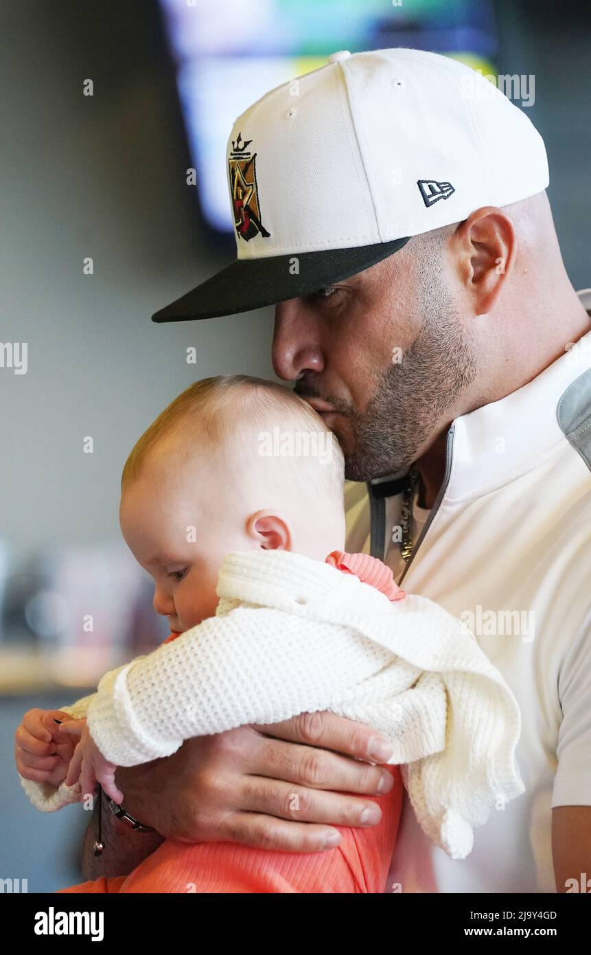 Chesterfield, United States. 25th May, 2022. St. Louis Cardinals Albert  Pujols kisses a babies head during the Pujols Foundation Golf Outing at Top  Golf in Chesterfield, Missouri on Wednesday May 25, 2022.