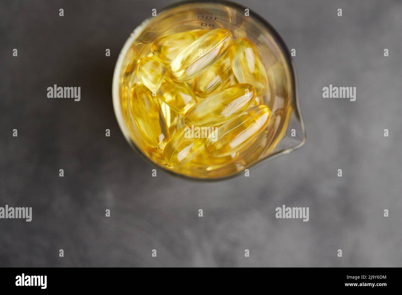 Capsules of omega3 fatty acids on a gray background. The concept of