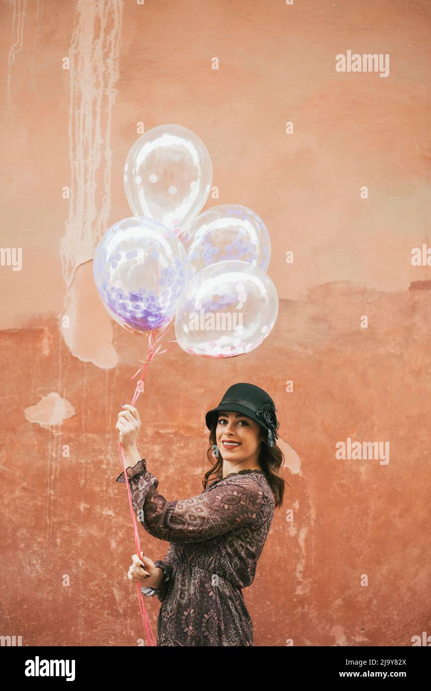 Woman alone happy balloons hi-res stock photography and images - Alamy