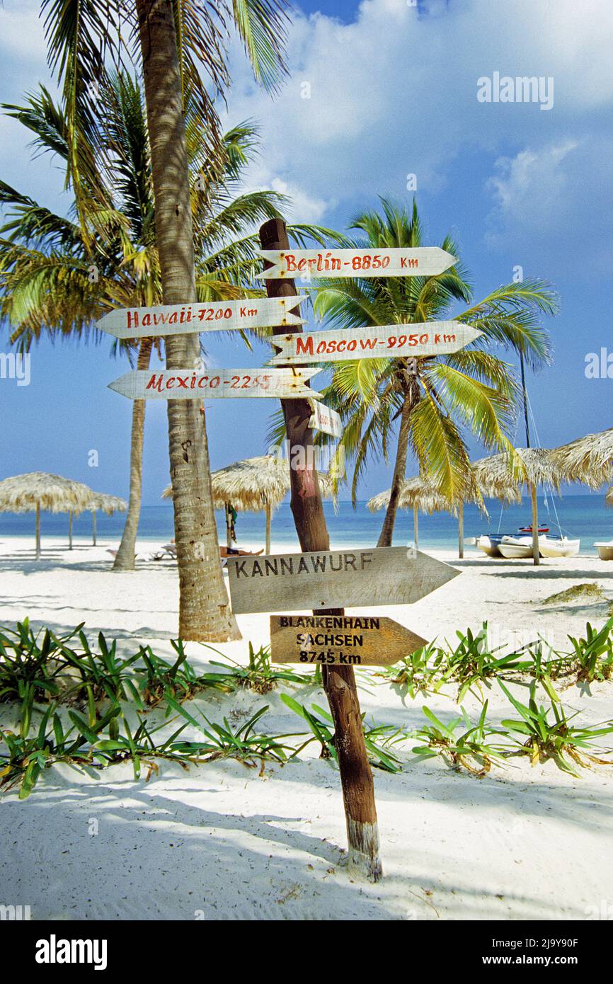 Funny signpost at the white sandy beach of Cayo Largo, Cuba, Caribbean Stock Photo