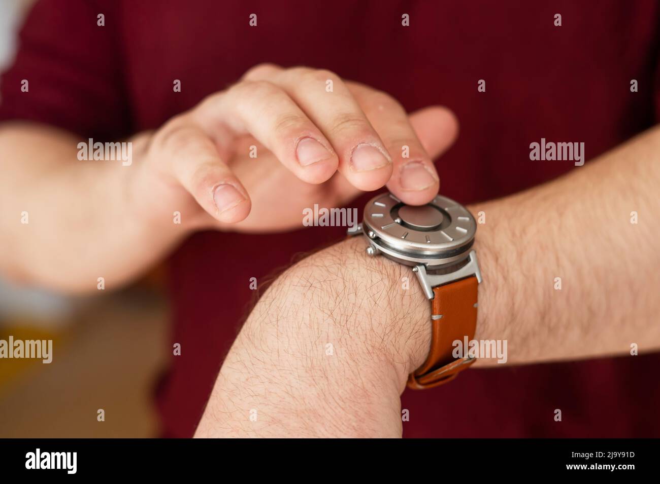 Special wristwatch for the blind with magnetic balls.  Stock Photo