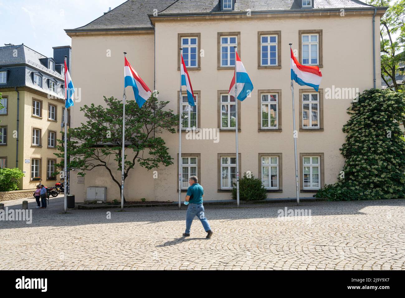 Luxembourg, May 2022. some Luxembourg flags in front of a building in the city center Stock Photo