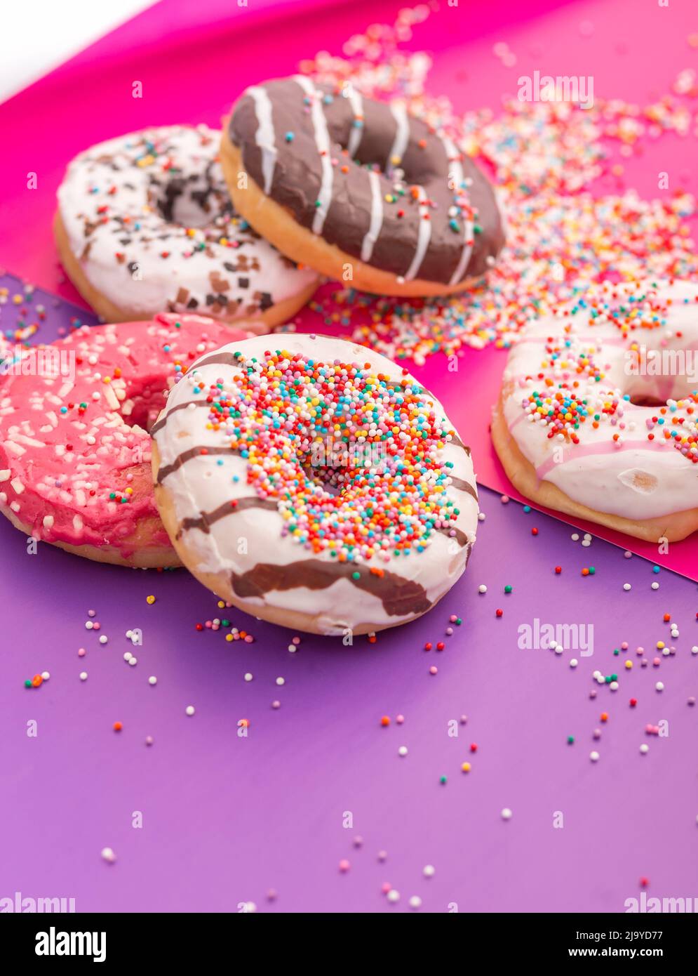 Donuts on a color background Stock Photo - Alamy