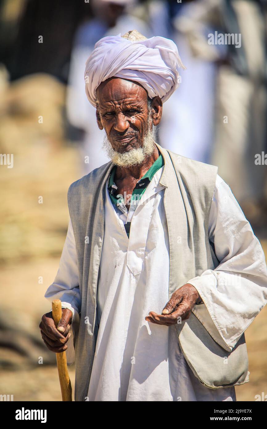 local-eritrean-man-in-traditional-white-dress-on-the-keren-camel-animal