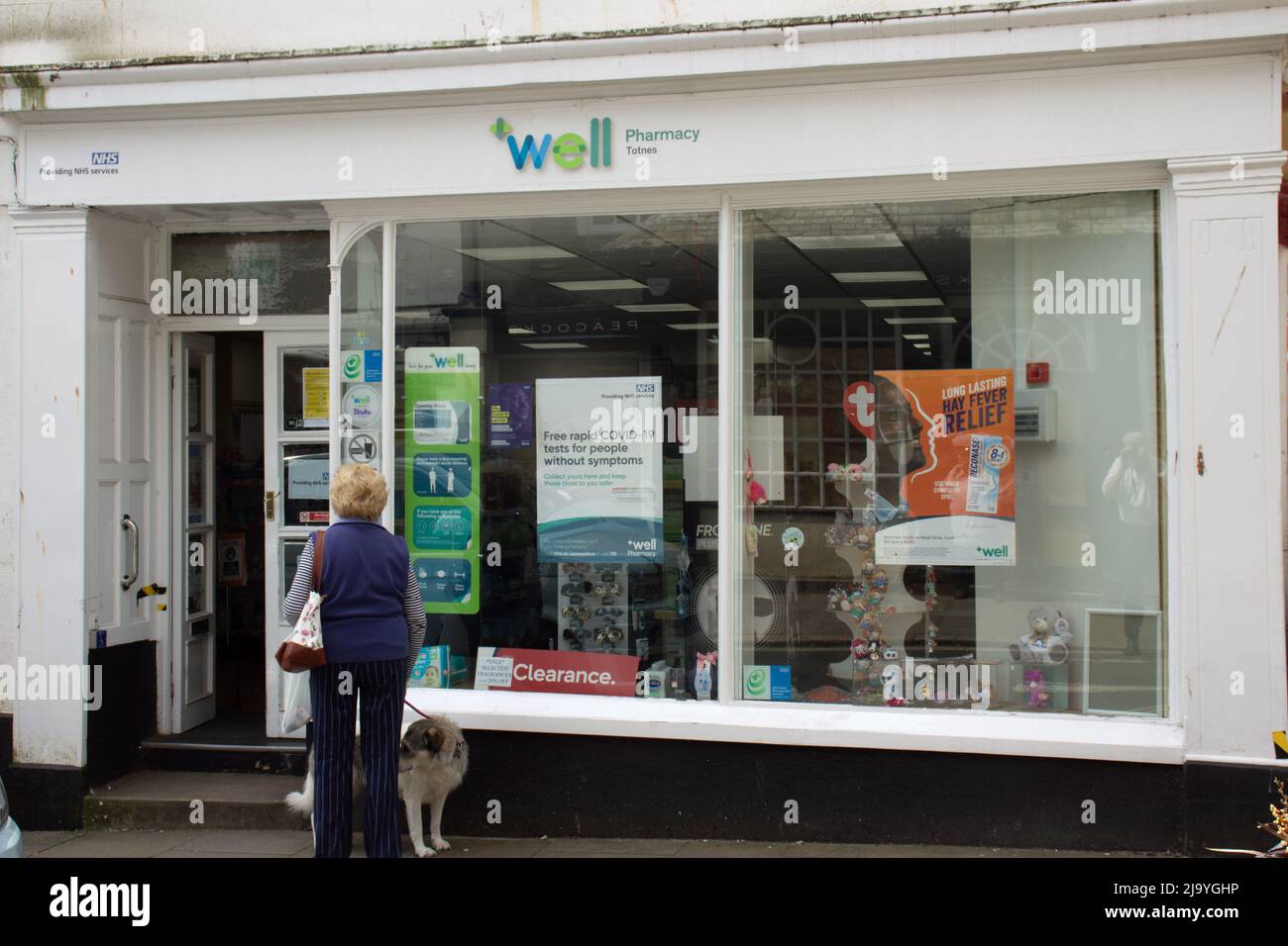 TOTNES, UK - JUNE 26, 2021 Well Pharmacy on Fore Street on a cloudy day Stock Photo