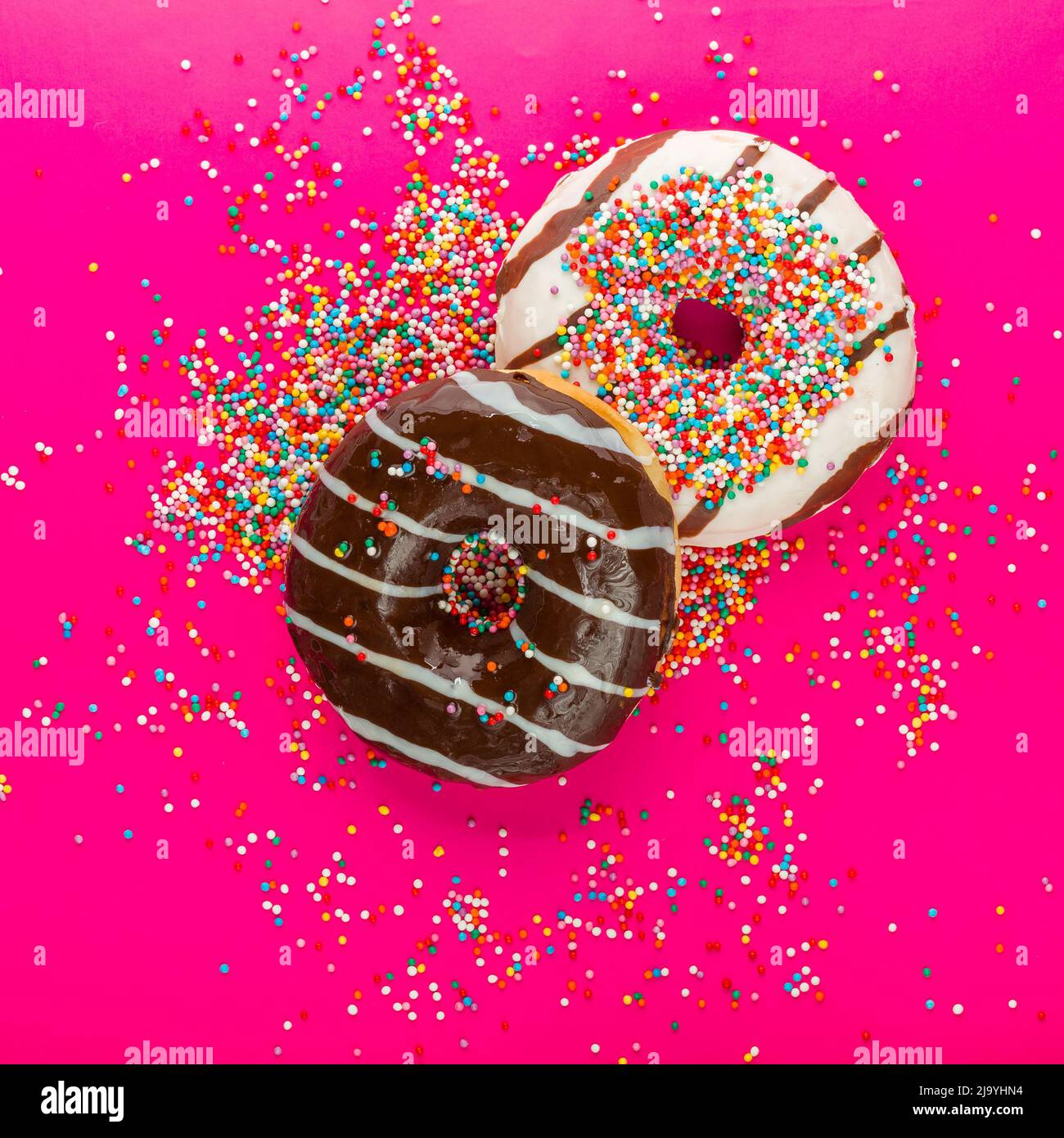 Donuts on a color background Stock Photo - Alamy