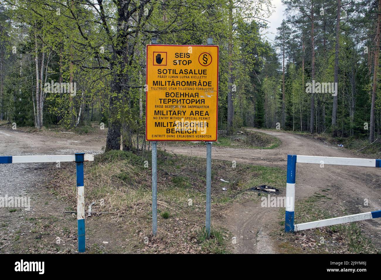 Military area keep out sign in Finnish, Swedish, Russian, English and German texts, Finland Stock Photo